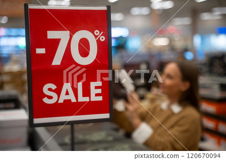 Huge discount during retail sale with customers shopping for bargains 120670094