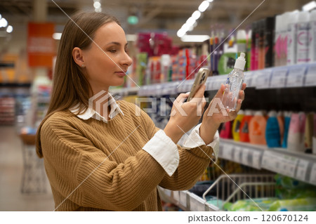 Woman shopping for personal care products in a store aisle in the afternoon Woman shopping for personal care products in a store aisle in the afternoon 120670124