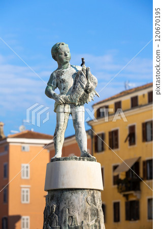 Rovinj, Croatia Boy with Fish fountain statue Rovinj, Croatia Boy with Fish fountain statue 120670195