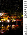 Illuminated autumn leaves and a bridge reflected in the pond at Daigoji Temple 120671325