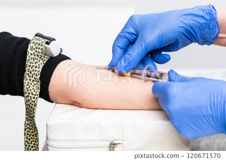 Medical Professional Collecting Blood Sample from Patient 120671570