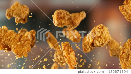 Fried Chicken Pieces Flying up in the Air. Fried Chicken Pieces Flying up in the Air. 120671594