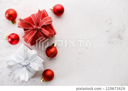 Red and white gift boxes on white marble background. Christmas New year concept. Selective focus. Red and white gift boxes on white marble background. Christmas New year concept. Selective focus. 120671629