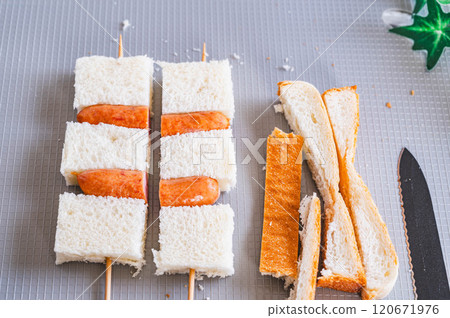 Skewered bread and wiener sausage Skewered bread and wiener sausage 120671976