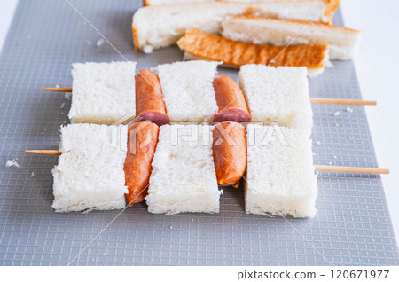 Skewered bread and wiener sausage 120671977