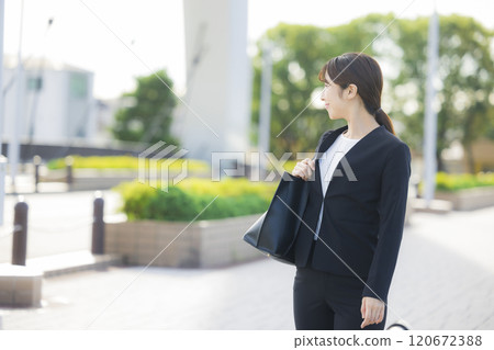 business woman wearing a suit business woman wearing a suit 120672388