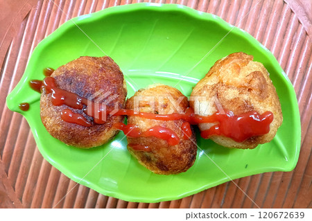 Potato croquettes - mashed potatoes balls breaded and deep fried 120672639