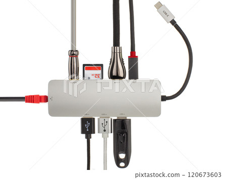 Close up of a sleek USB hub with various connected cables and devices, illustrating technology and connectivity. Close up of a sleek USB hub with various connected cables and devices, illustrating technology and connectivity. 120673603