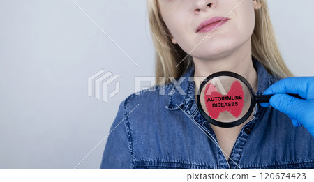 Thyroid disease and autoimmune diseases. An endocrinologist examines a patient's thyroid gland with a magnifying glass. Control of thyroid hormones 120674423