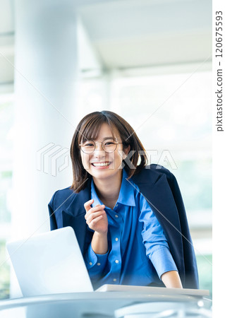 woman working on a computer woman working on a computer 120675593