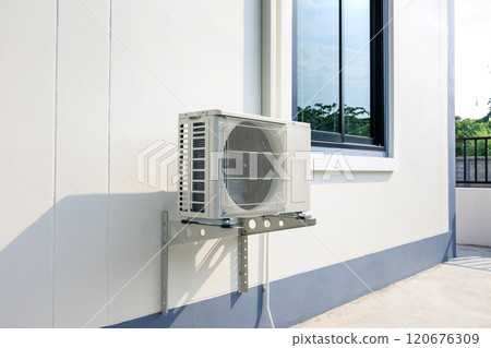 Condenser unit outside home. 120676309