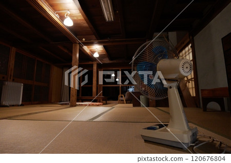 Old-fashioned house and electric fan Old-fashioned house and electric fan 120676804