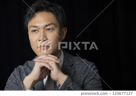 Businessman on black background Businessman on black background 120677127
