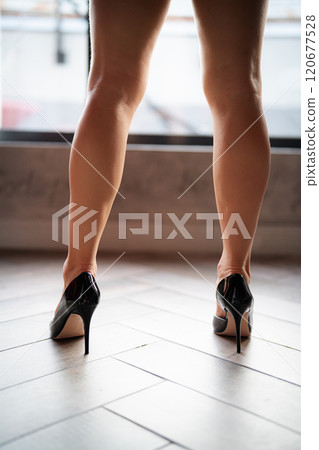 Woman feet high heels shoes in bathrobe at home, closeup Woman feet high heels shoes in bathrobe at home, closeup 120677528