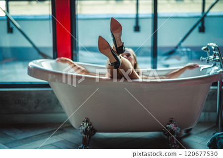 Woman feet high heels shoes in bathrobe at home, closeup Woman feet high heels shoes in bathrobe at home, closeup 120677530