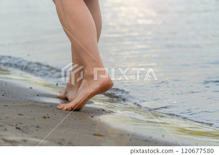 Beach travel - woman walking Beach travel - woman walking 120677580