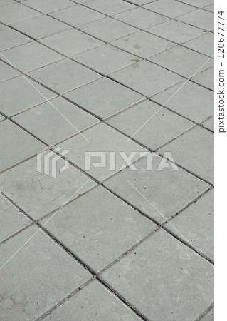 Perspective View of Monotone Gray Brick Stone on The Ground for Street Road. Sidewalk, Driveway, Pavers, Pavement 120677774