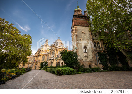 Budapest, Hungary. August 27, 2022. Inside the Vajdahunyad Castle complex is the Museum of Natural History and Agriculture. The yellow Baroque facade is characteristic. People visiting. 120679324