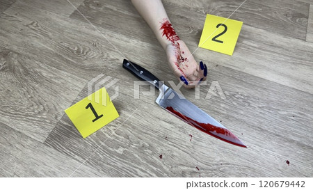 Bloody knife next to body of girl with blood and traces of crime. Evidence markers near murder weapon and crime victim on floor. Bloody traces of girl murder in apartment Bloody knife next to body of girl with blood and traces of crime. Evidence markers near murder weapon and crime victim on floor. Bloody traces of girl murder in apartment 120679442