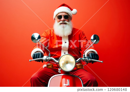 A man dressed as Santa Claus riding a red scooter 120680148