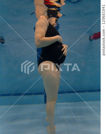 Pregnant Woman Underwater in Swimming Pool 120681041