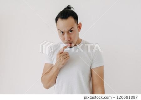 Doubt hesitate funny face man in white t-shirt isolate on white. 120681887