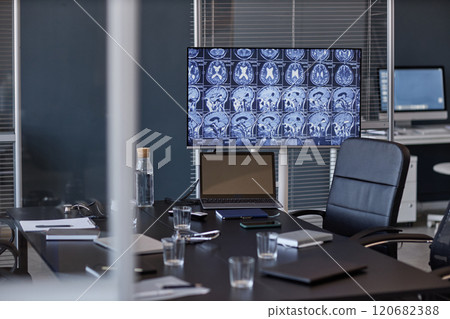 Background shot of open laptop showing X ray scan imaging of patients brain on screen resting on table in medical office, copy space Background shot of open laptop showing X ray scan imaging of patients brain on screen resting on table in medical office, copy space 120682388