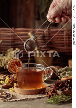 Tea with ingredients and slices of dried oranges. Tea with ingredients and slices of dried oranges. 120682769
