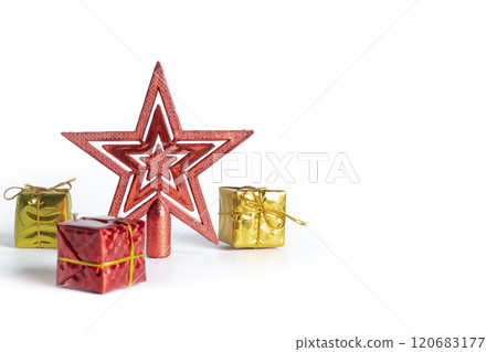 Festive red Christmas star ornament with colorful gift boxes on white background Festive red Christmas star ornament with colorful gift boxes on white background 120683177