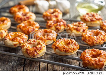 Mini pizza bagels on wooden table. 120683396