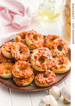 Mini pizza bagels on plate on white table. 120683408