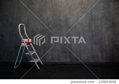 ladder with a gift in the interior of a room 120683698