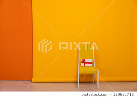 One Yellow Chair And Gift In Room One Yellow Chair And Gift In Room 120683718