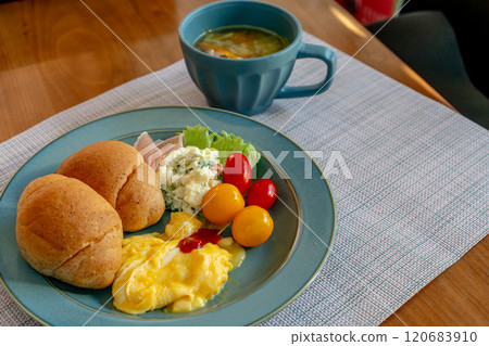 Breakfast with bread, eggs, soup and fruit 120683910