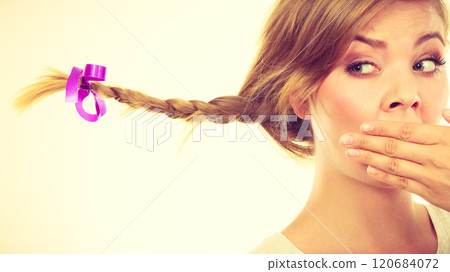 Sad teenage girl in windblown braid hair 120684072
