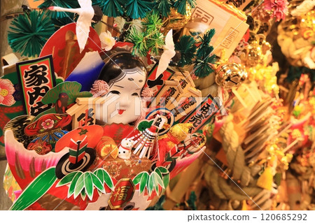 Tori-no-ichi: Auspicious rakes - A stall displaying auspicious rakes Tori-no-ichi: Auspicious rakes - A stall displaying auspicious rakes 120685292