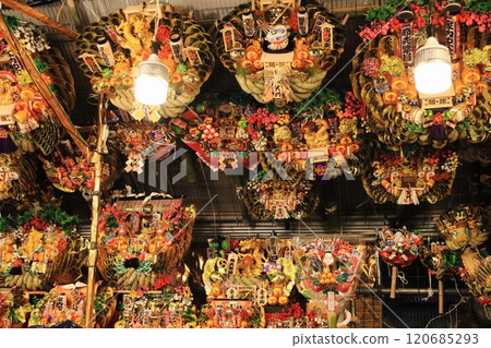 Tori-no-ichi: Auspicious rakes - A stall displaying auspicious rakes 120685293
