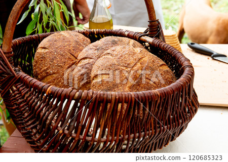 three sourdough whole grain loaf of bread in the basket 120685323