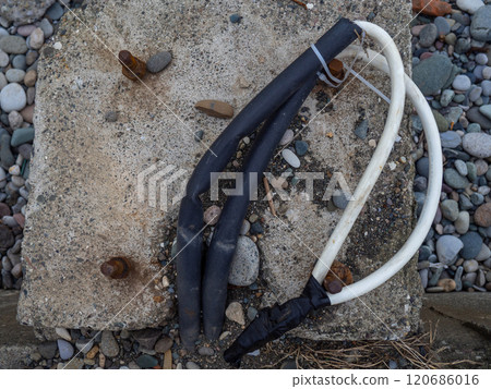 Wires sticking out of the ground for installing a lantern. Wiring for a street lamp. Wires sticking out of the ground for installing a lantern. Wiring for a street lamp. 120686016