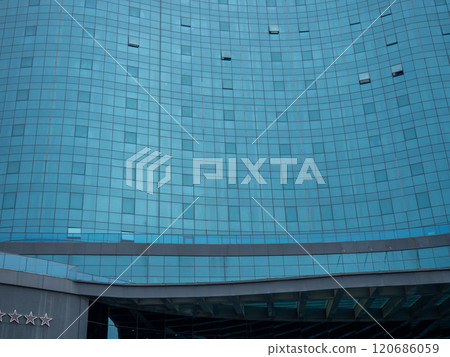 Windows of a modern hotel. Mirrored blue windows. Architecture pattern. Windows of a modern hotel. Mirrored blue windows. Architecture pattern. 120686059