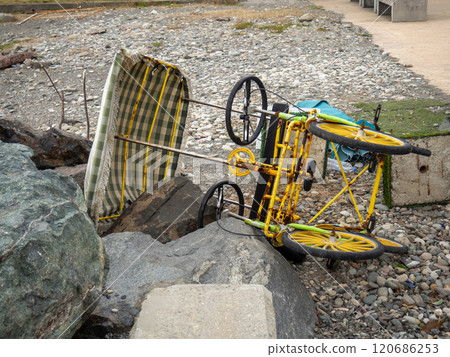 Broken walking car on pedals. The attraction doesn't work. Entertainment for tourists. Four wheel vehicle Broken walking car on pedals. The attraction doesn't work. Entertainment for tourists. Four wheel vehicle 120686253