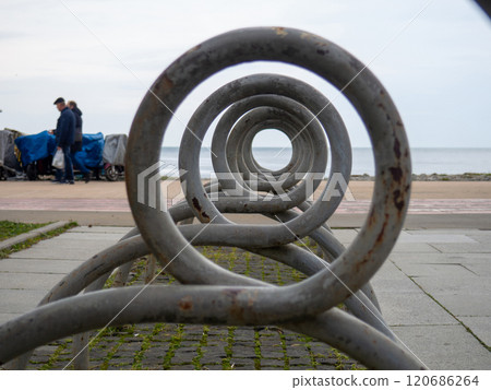 Bicycle parking. infrastructure in the park. Place for bicycles. Empty. Unusual angle.Bicycle parking Bicycle parking. infrastructure in the park. Place for bicycles. Empty. Unusual angle.Bicycle parking 120686264