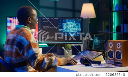 African american IT professional managing AI system for machine learning, coding software on terminal window. Futuristic interface program focuses on cybersecurity, networking for database. Camera A. 120686540