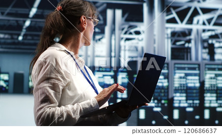 Experienced manager working in data center housing GPU dedicated supercomputers that can process AI tasks with high efficiency, repairing unfunctional units used for machine learning 120686637