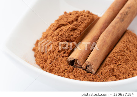 Cinnamon powder and cinnamon sticks close-up Cinnamon powder and cinnamon sticks close-up 120687194