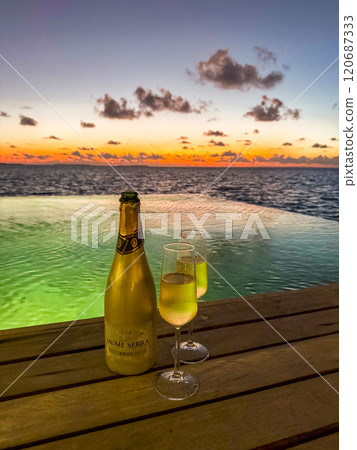 Sunset views from overwater pool villa in Maldives Sunset views from overwater pool villa in Maldives 120687333