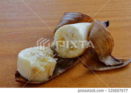 A banana on a table A banana on a table 120687677