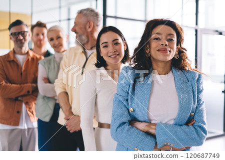 Half length portrait of African American businesswoman looking at camera and feeling proud of successful team Half length portrait of African American businesswoman looking at camera and feeling proud of successful team 120687749