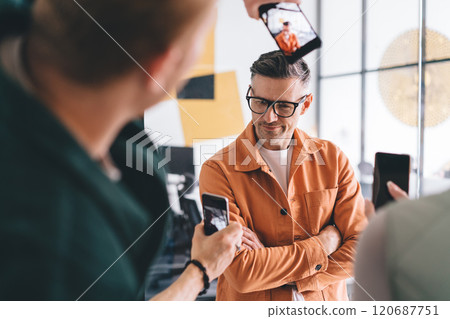 Caucasian corporate director in eyeglasses enjoying popularity 120687751