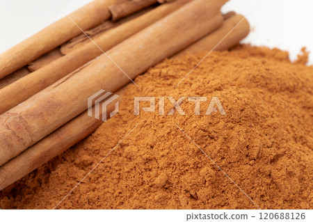 Cinnamon powder and cinnamon sticks close-up Cinnamon powder and cinnamon sticks close-up 120688126